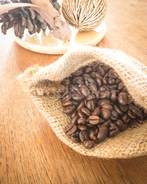 Coffee roasted bean on wooden table vintage style  Stock photo © nalinratphi
