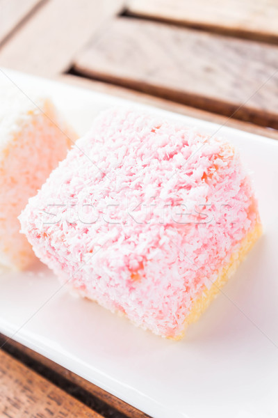 Pink lamington cakes up close on wood table Stock photo © nalinratphi