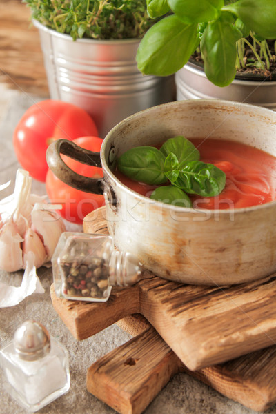 tomato soup with basil in a pot on the marble Stock photo © Naltik