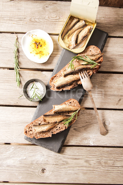 Sandwich Tapas with sardines, sprats with olives and salt Stock photo © Naltik