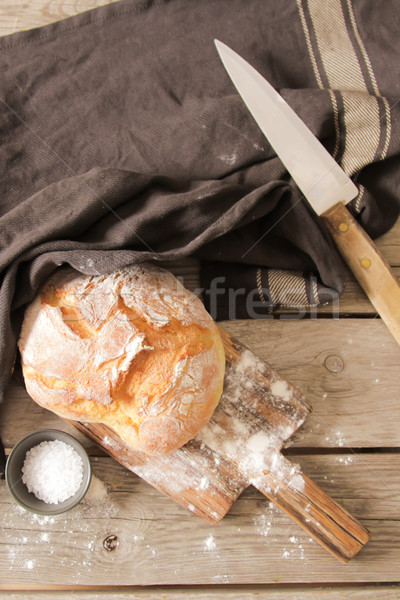 Fresh bread and salt on a wooden background Stock photo © Naltik