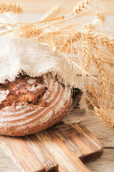 bread and wheat on the wooden background Stock photo © Naltik