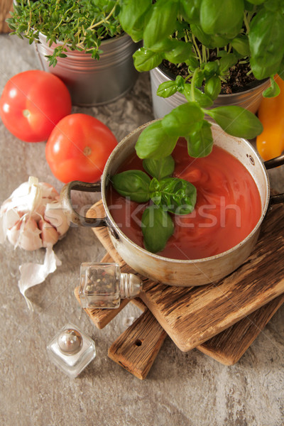 tomato soup with basil in a pot on the marble Stock photo © Naltik