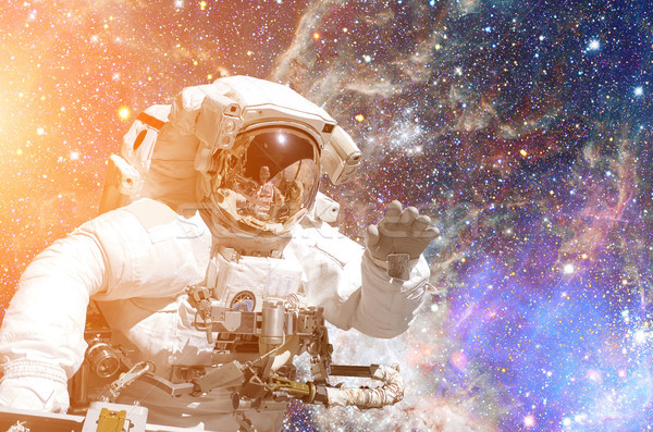 Astronaut in outer space. Galaxy and stars on the background. Stock photo © NASA_images