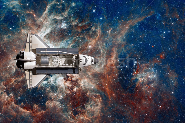 Space Shuttle flight over space nebula. Stock photo © NASA_images