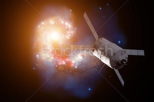 Cargo spacecraft - The Automated Transfer Vehicle over spiral galaxy. Stock photo © NASA_images