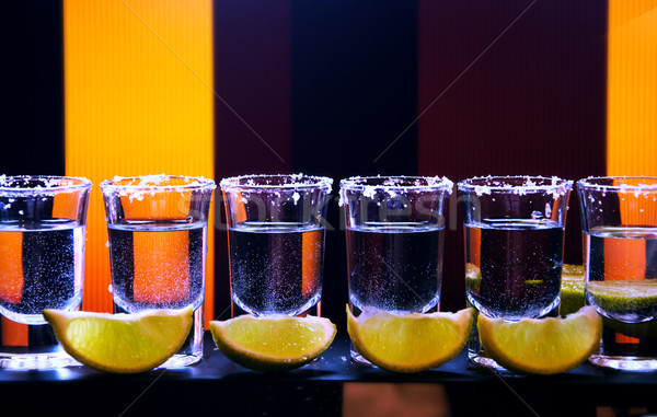 Stock photo: Shot drink set with citrus slices on bar