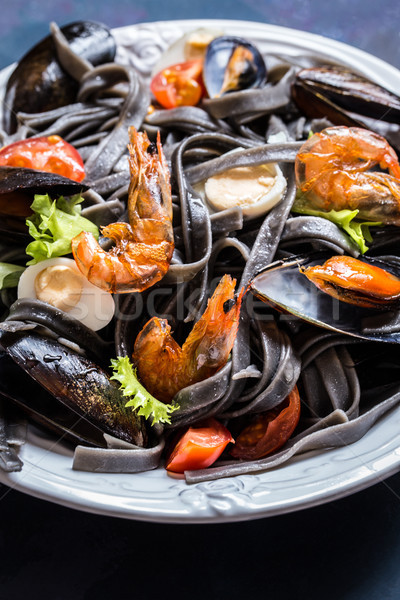 The seafood with black pasta, mussels, shrimp and vegetables Stock photo © Natalya_Maiorova