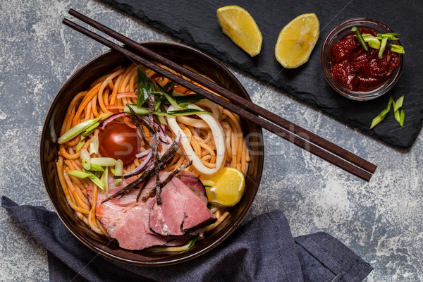 Stock photo: Noodle soup Asian with meat, vegetables and herbs, squid