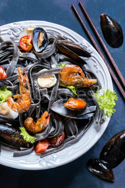 The seafood with black pasta, mussels, shrimp and vegetables Stock photo © Natalya_Maiorova
