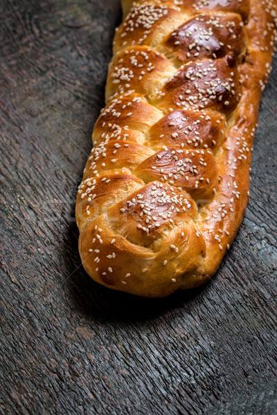 Challah is a Jewish bread to feast on wooden boards Stock photo © Natalya_Maiorova