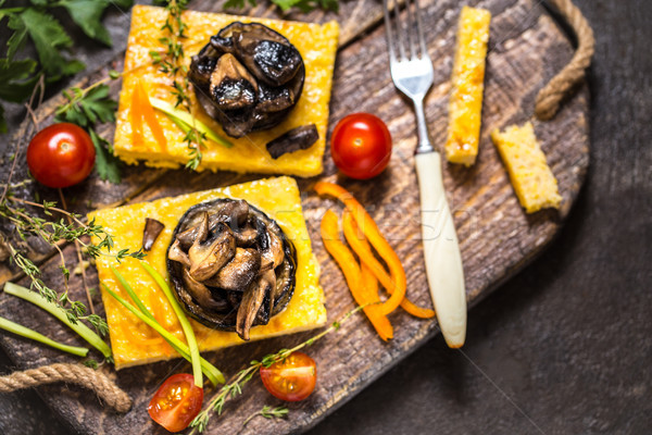 corn polenta with roasted mushrooms and eggplant, traditional Italian food Stock photo © Natalya_Maiorova