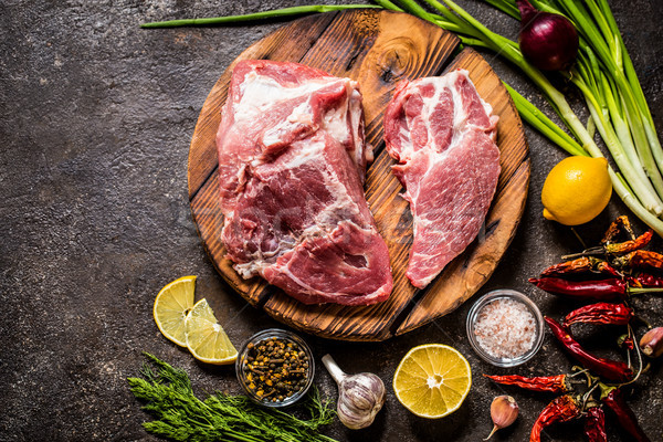 meat fillet of pork with herbs and lemon on wooden Board Stock photo © Natalya_Maiorova