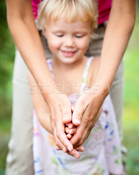 Mother with daughter outdoors Stock photo © naumoid