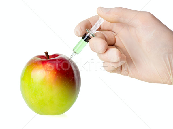 Biotehnologie verde măr injecţie rapid mână Imagine de stoc © naumoid