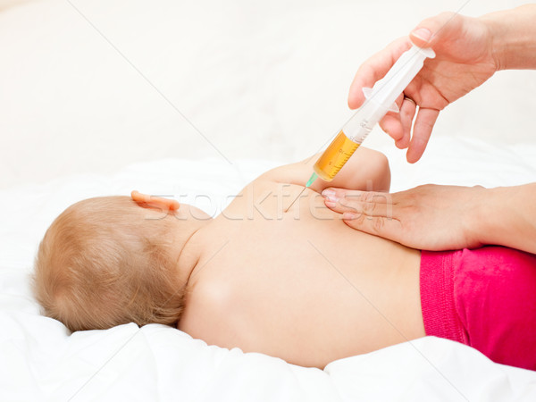 Little baby get an injection Stock photo © naumoid