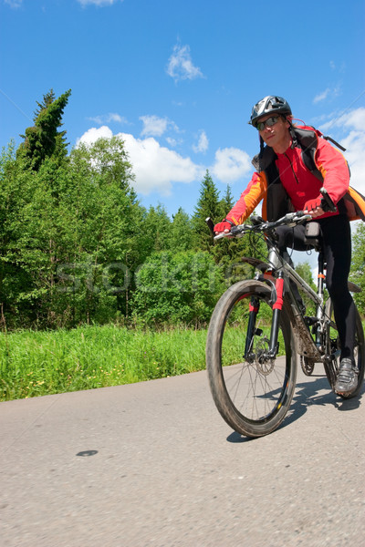 Travelling cyclist Stock photo © naumoid