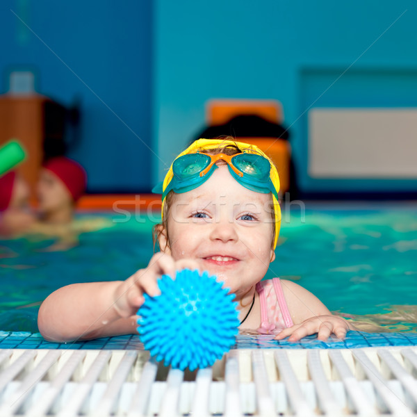 Child in a swimming pool Stock photo © naumoid