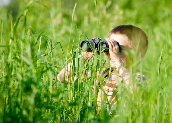 Stock photo: Kid with binocular