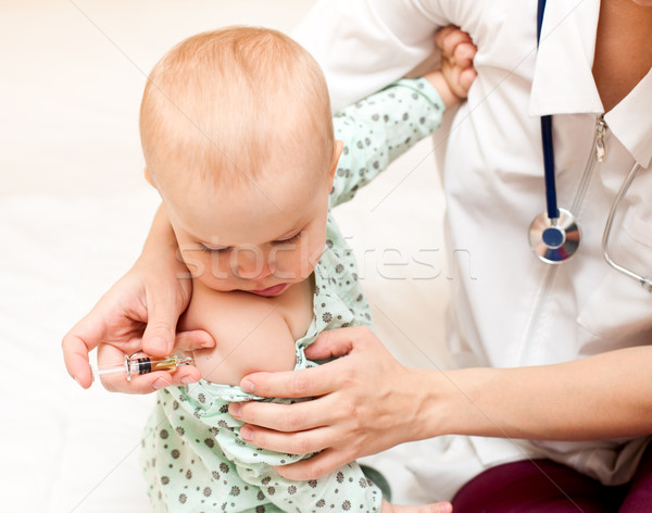 Stock photo: Little baby get an injection