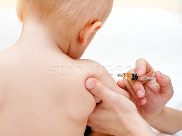 Weinig baby injectie arts kind arm Stockfoto © naumoid