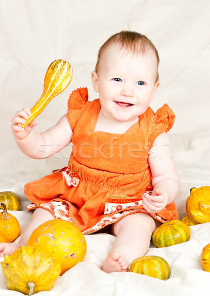 Infant with pumpkin Stock photo © naumoid