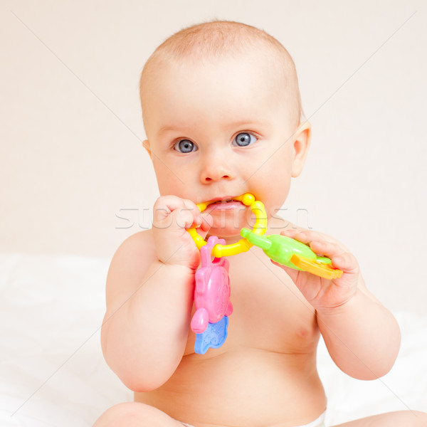 Infant with teething toy Stock photo © naumoid