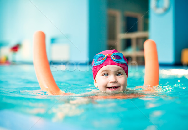 Child in a swimming pool Stock photo © naumoid