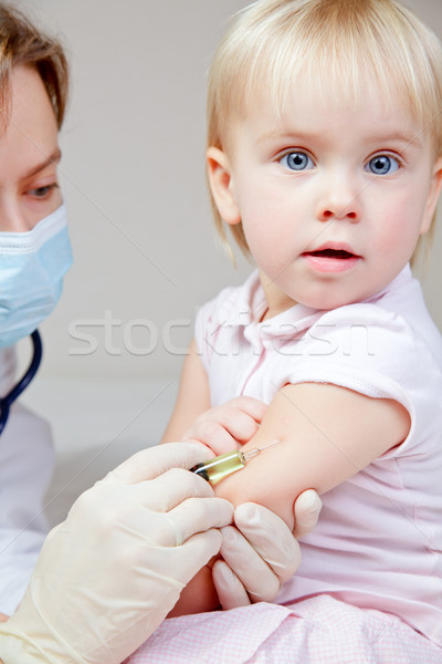 Little baby girl gets an injection Stock photo © naumoid