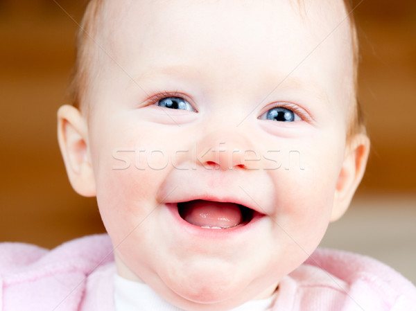 Derűs csecsemő portré kislány mosoly arc Stock fotó © naumoid