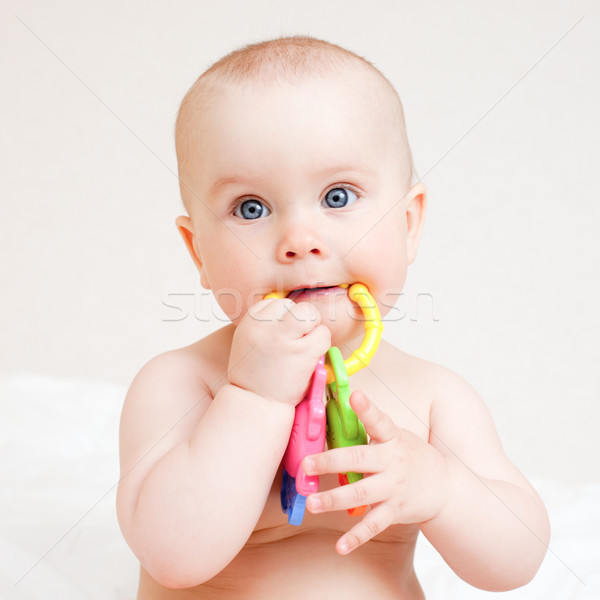 Infant with teething toy Stock photo © naumoid