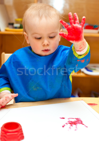 Child painting with hand Stock photo © naumoid