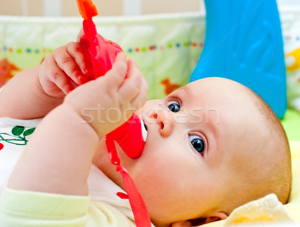 Infant with teething toy Stock photo © naumoid