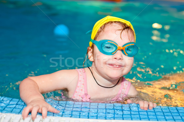 Child in a swimming pool Stock photo © naumoid