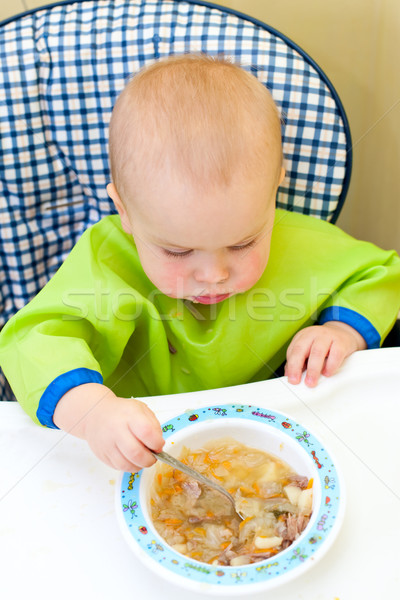 Baby eating Stock photo © naumoid