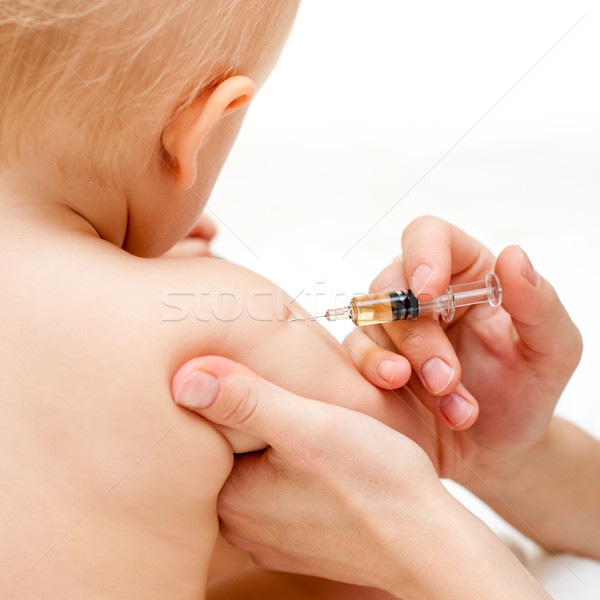 Weinig baby injectie arts kind arm Stockfoto © naumoid