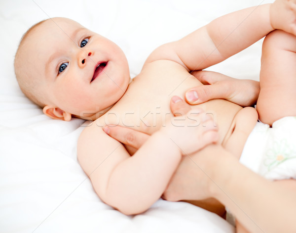 Baby massage Stock photo © naumoid