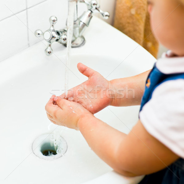 Little girl washing hands Stock photo © naumoid