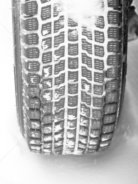 Winter tyre on a vehicle Stock photo © naumoid