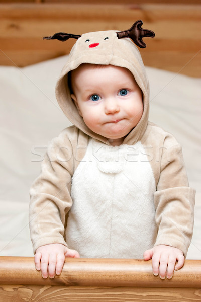 Infant in deer costume Stock photo © naumoid