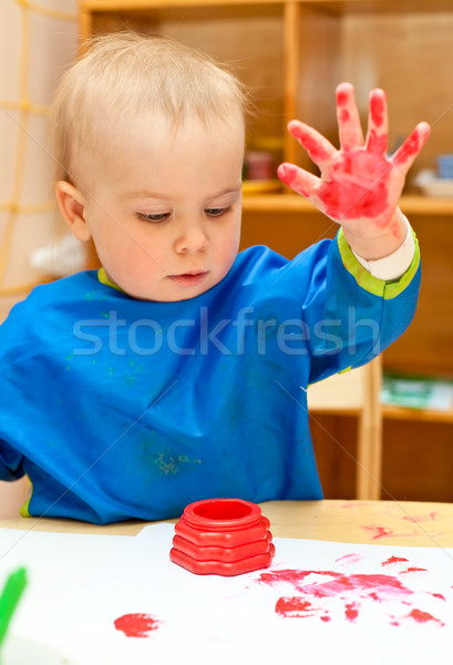 Child painting with hand Stock photo © naumoid