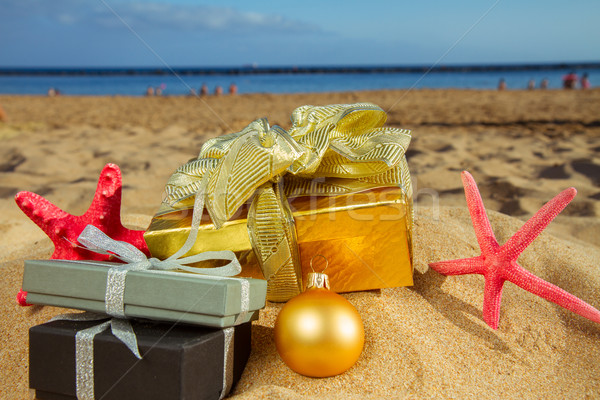 Stock photo: christmas gifts on beach