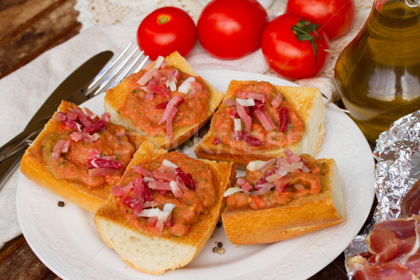 plate of bread with tomatoes and jamon Stock photo © neirfy
