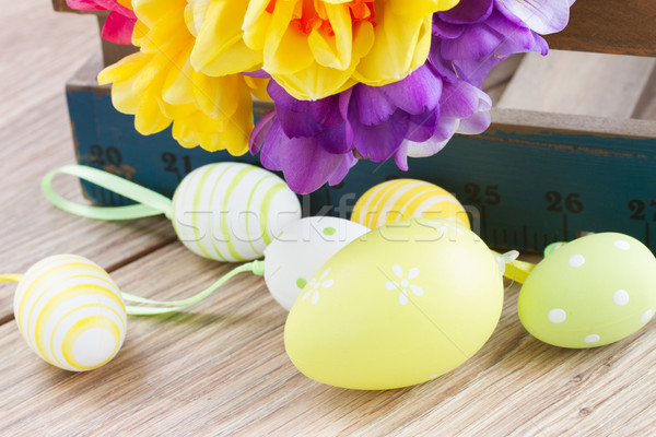 easter eggs and posy  of spring flowers on wooden table Stock photo © neirfy