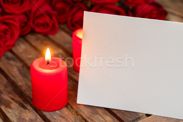 Stock photo: Two burning candles with fresh roses