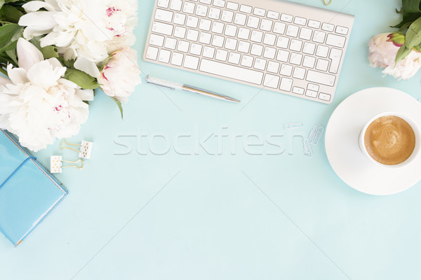 Flat lay home office workspace on blue Stock photo © neirfy