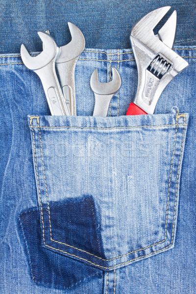 set of spanners in jeans pocket Stock photo © neirfy