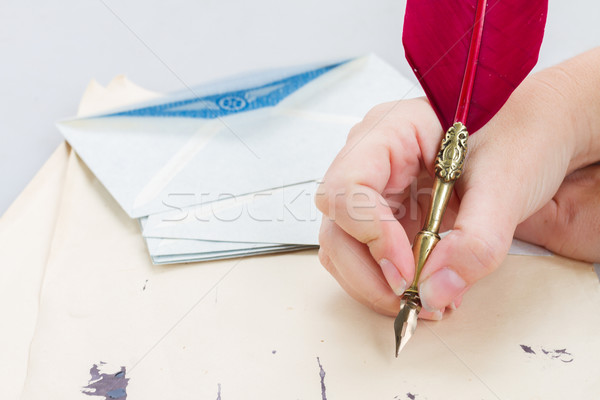 hand holding feather pen  Stock photo © neirfy