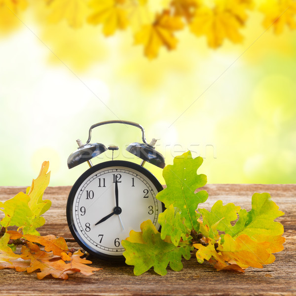 Stock photo: Autumn time - fall leaves with clock