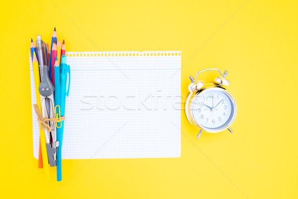 Снова в школу небольшой будильник школьные принадлежности лист бумаги Сток-фото © neirfy